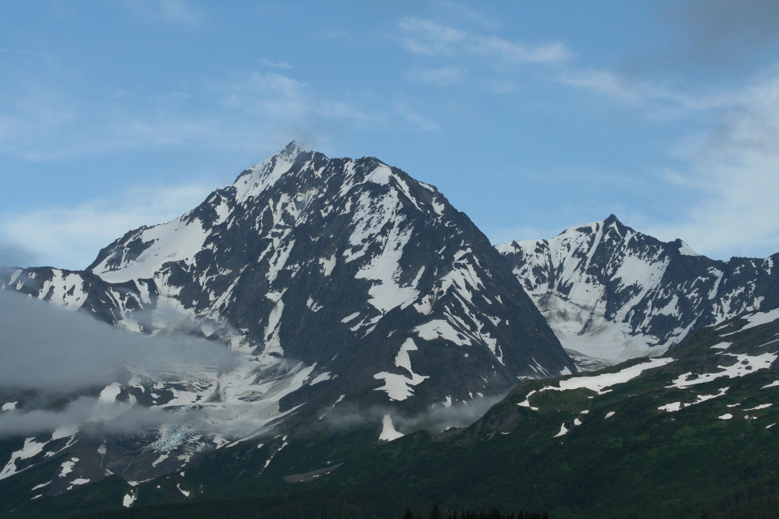 Snow-covered Alaska mountains from the HandyMedics website